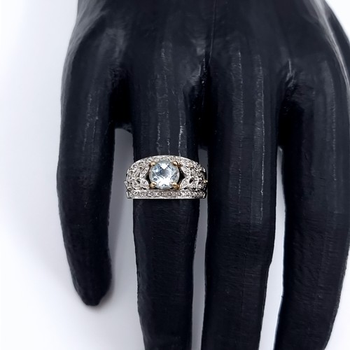 3 - Star Lot: A fine aquamarine and diamond ring set in nine carat gold. Size M. Weight 3.52 grams. Ther... 