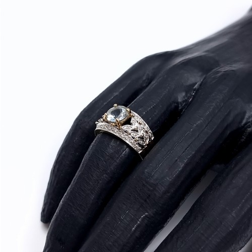 3 - Star Lot: A fine aquamarine and diamond ring set in nine carat gold. Size M. Weight 3.52 grams. Ther... 