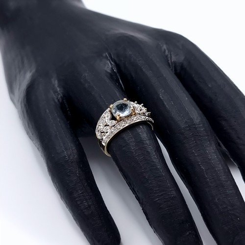 3 - Star Lot: A fine aquamarine and diamond ring set in nine carat gold. Size M. Weight 3.52 grams. Ther... 