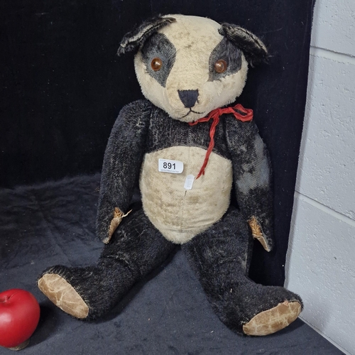 891 - A large antique mohair jointed teddy bear.