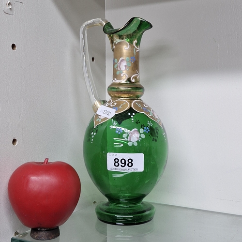 898 - An eye catching Bohemian green glass handblown gold decor pitcher.