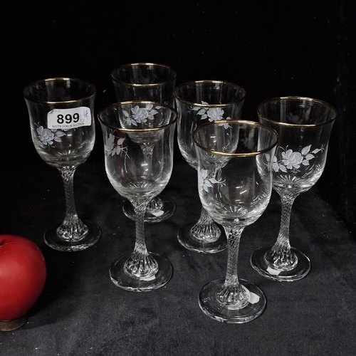 899 - A stunning set of six vintage wine glasses all featuring a spiral twist effect stem, etched floral d... 
