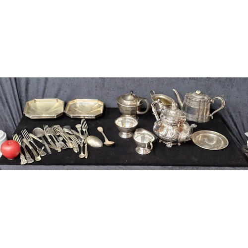 844 - A Large selection of antique table ware comprising of, cutlery, teapots, sugar bowl and milk jug.