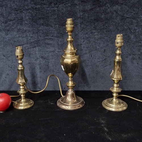 882 - A trio of classic vintage solid brass  table lamp bases. Three graduated sizes.