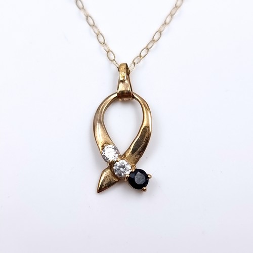 32 - Star Lot: A nine carat gold 375 sapphire and gemstone pendant necklace. Length 44cm. Weight 1.11 gra... 