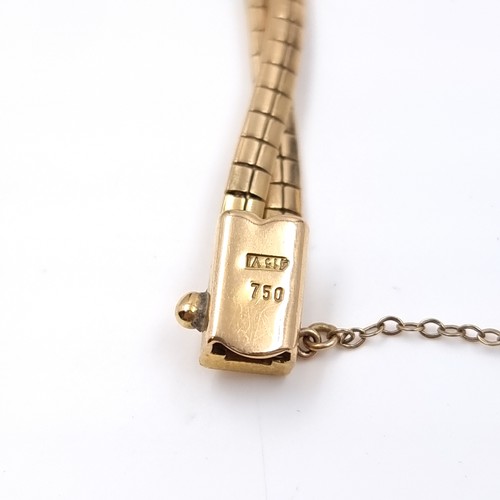 28 - Star Lot: An 18 carat gold 750 twin band bracelet set with safety chain. Weight 15.79 grams.

There ... 