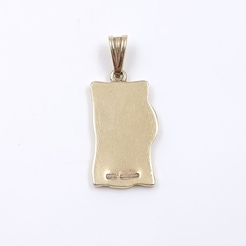 31 - Star Lot: A nine carat gold 375 Celtic designed pendant. Weight 4.77 grams.