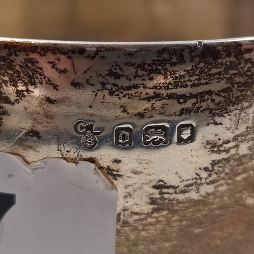37 - A sterling silver dish rim with slight split. Hallmarked London, 1919. With faint inscription, easil... 