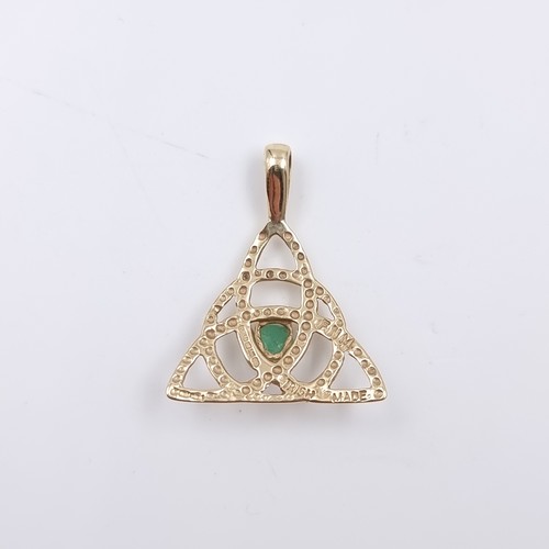 38 - Star Lot: A 14 carat gold 585 Celtic style pendant set with centre emerald gemstone. Weight 1.55 gra... 