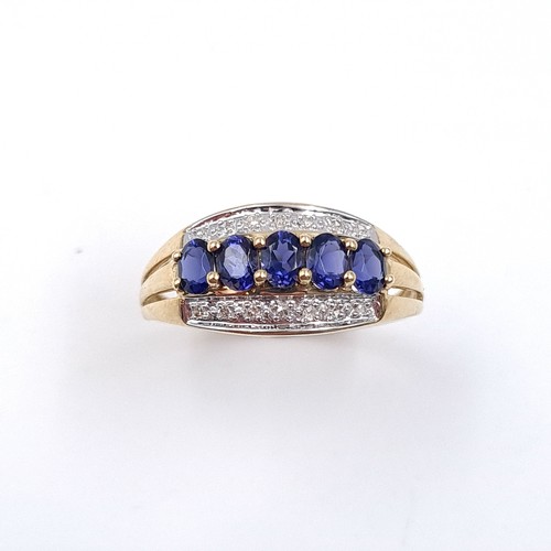 1 - Star Lot: A stunning iolite and diamond ring set in nine carat gold. Size R. Weight 2.37 grams. This... 
