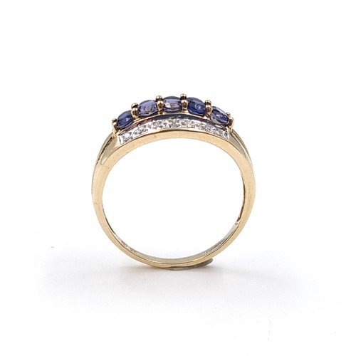 1 - Star Lot: A stunning iolite and diamond ring set in nine carat gold. Size R. Weight 2.37 grams. This... 