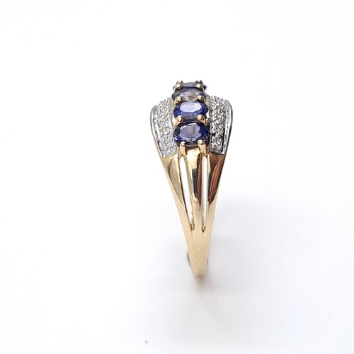 1 - Star Lot: A stunning iolite and diamond ring set in nine carat gold. Size R. Weight 2.37 grams. This... 
