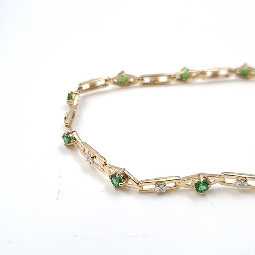 2 - Star Lot: A fine diamond and diopside bracelet set nine carat gold. Weight 5.66 grams.