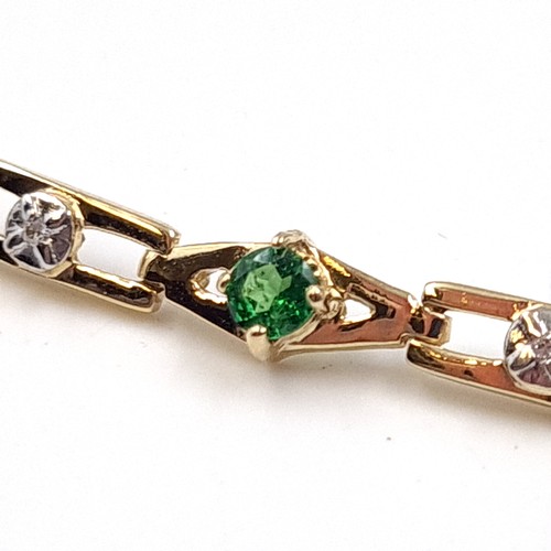 2 - Star Lot: A fine diamond and diopside bracelet set nine carat gold. Weight 5.66 grams.