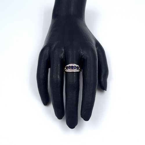 1 - Star Lot: A stunning iolite and diamond ring set in nine carat gold. Size R. Weight 2.37 grams. This... 