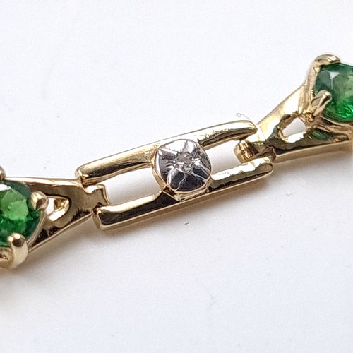 2 - Star Lot: A fine diamond and diopside bracelet set nine carat gold. Weight 5.66 grams.