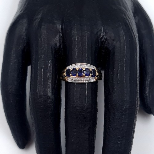 1 - Star Lot: A stunning iolite and diamond ring set in nine carat gold. Size R. Weight 2.37 grams. This... 