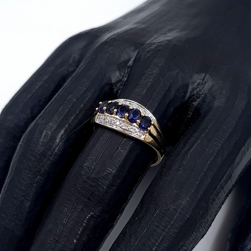 1 - Star Lot: A stunning iolite and diamond ring set in nine carat gold. Size R. Weight 2.37 grams. This... 