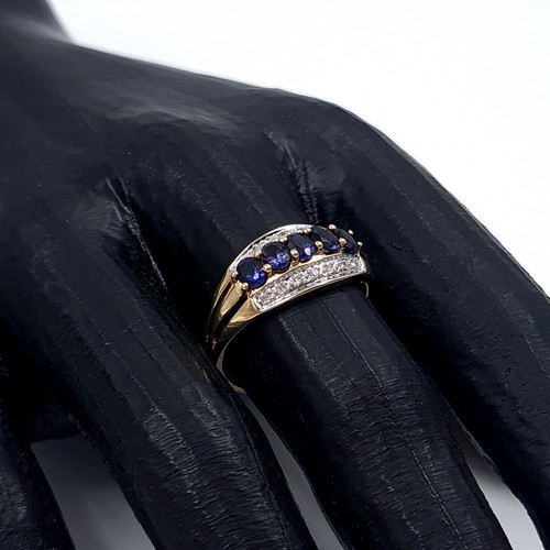 1 - Star Lot: A stunning iolite and diamond ring set in nine carat gold. Size R. Weight 2.37 grams. This... 