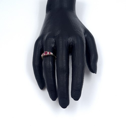 3 - Star Lot: A beautiful ruby and diamond ring set in nine carat gold. Size O. Weight 1.99 grams.