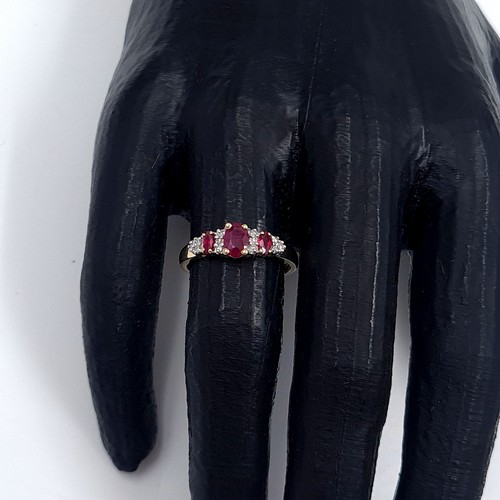 3 - Star Lot: A beautiful ruby and diamond ring set in nine carat gold. Size O. Weight 1.99 grams.