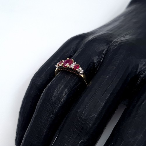 3 - Star Lot: A beautiful ruby and diamond ring set in nine carat gold. Size O. Weight 1.99 grams.