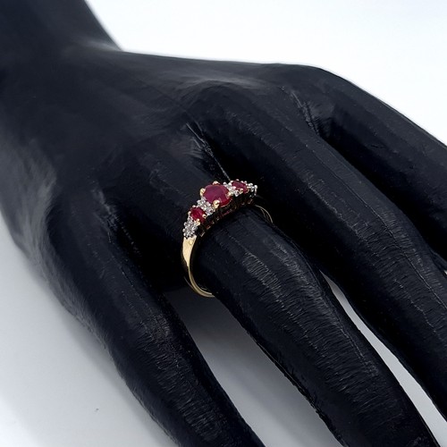 3 - Star Lot: A beautiful ruby and diamond ring set in nine carat gold. Size O. Weight 1.99 grams.
