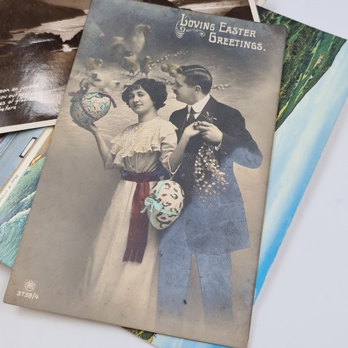 A large collection of over 80 assorted coloured and b&w postcards ...