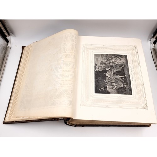 1223 - Star Lot: A superb example of an antique very large Holy Bible with beautiful plates, protected by r... 