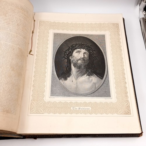 1223 - Star Lot: A superb example of an antique very large Holy Bible with beautiful plates, protected by r... 