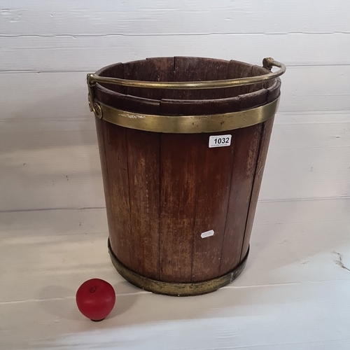 Star Lot : A fabulous Victorian oak stave fireside bucket, cylindrical, bound with brass bands and fitted with a hinged brass swing handle, interior tin liner.