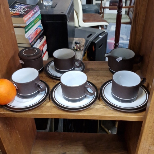Mid-century Hornsea England ‘Contrast’ stoneware coffee service, matte brown with white interior, comprising five cups with saucers, lidded sugar bowl and milk jug, circa 1974 design by Martin Hunt.