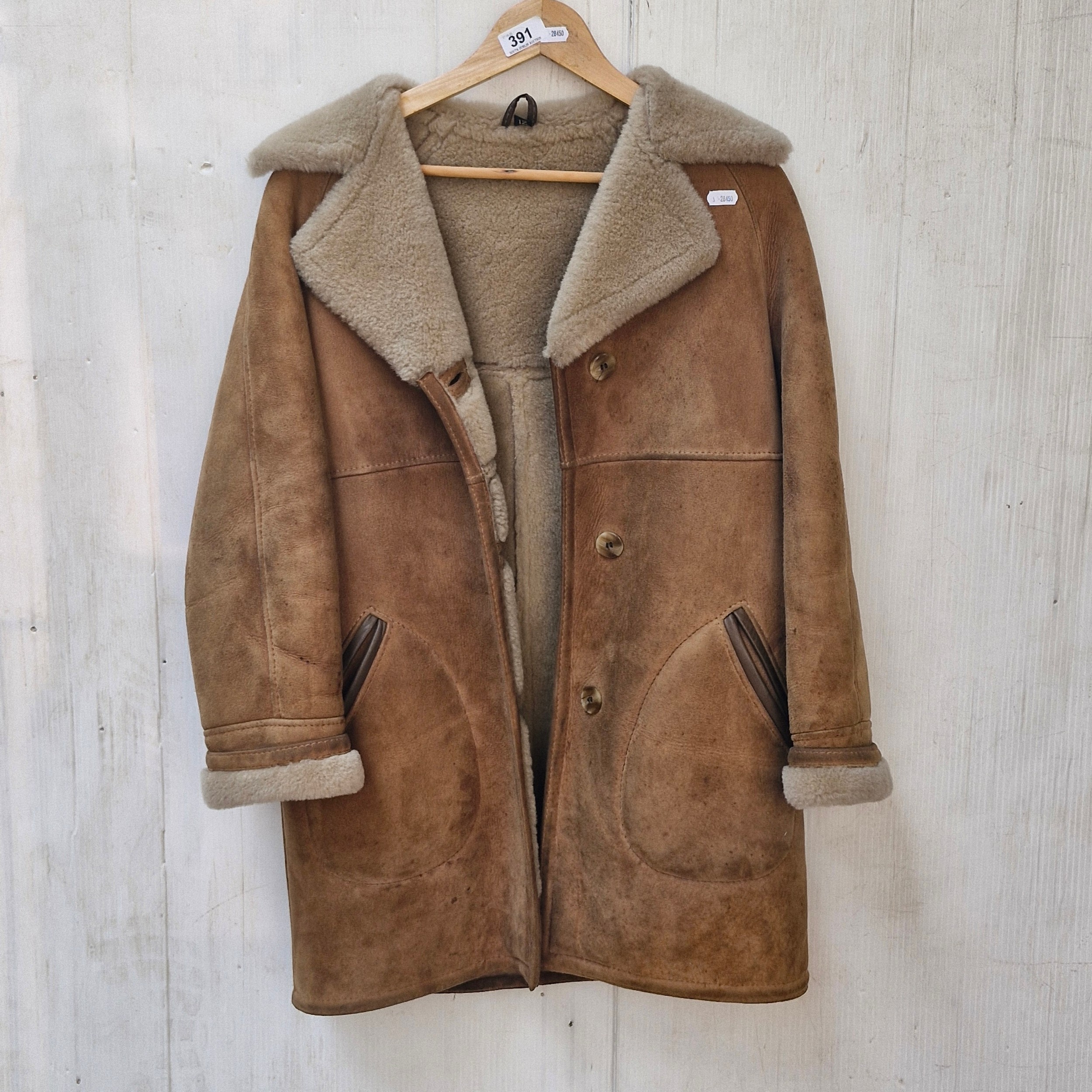 A 1960's The Taube Collection 100% sheepskin coat. Size 12.