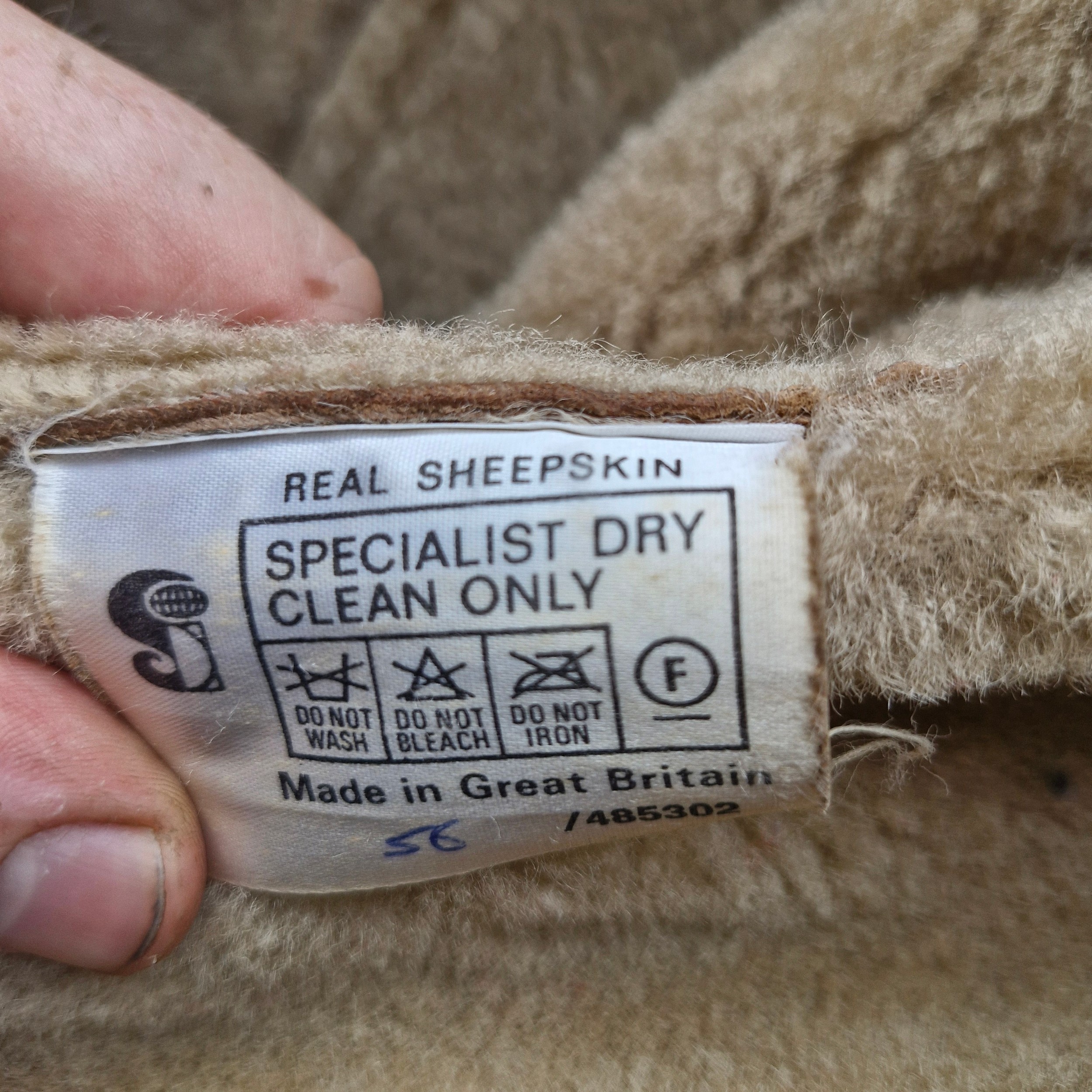A 1960's The Taube Collection 100% sheepskin coat. Size 12.