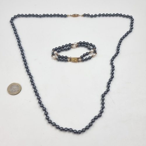 Pair of hematite bead necklace and double-strand hematite with cultured pearl bracelet, each fitted with gold-tone Cold to the touch sterling silver clasps, bracelet stamped 925.