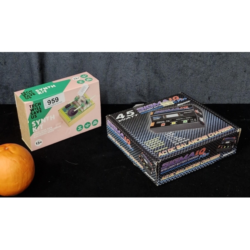 A boxed as new Ripmax Sigma EQ Mini AC/DC Intelligent Battery Charger and a Tech Will save Us All Miniature Synth Kit.

Previous in auction on T110925  - 14/09/2025 with Lot no.959
