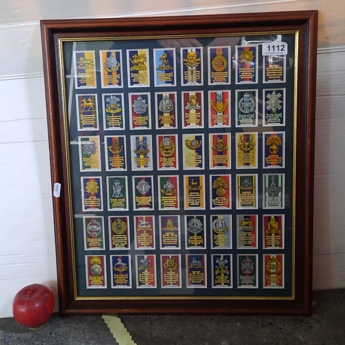 Framed collection of 50 Wills's cigarette cards, each depicting insignia  and battle honours of Briti