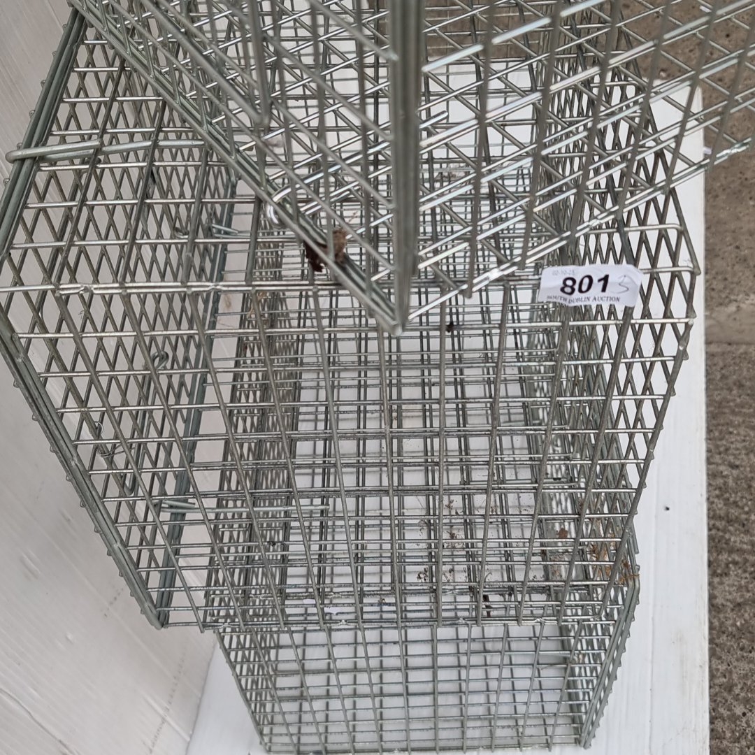 Group of three rectangular galvanized wire mesh cages with hinged ...