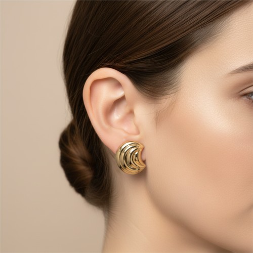 13 - A pair of nine carat gold stud earrings. Weight - 1.66 grams.