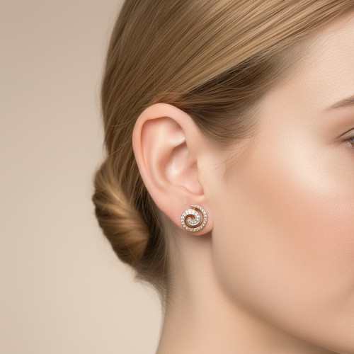 15 - Star Lot : A pretty pair of nine carat gold Diamond swirl design stud earrings. Weight - 1.53 grams