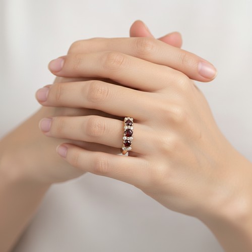 43 - Star Lot : A Three Garnet and White Tourmaline 375 nine carat gold. Size - P, Weight - 2.73 grams.