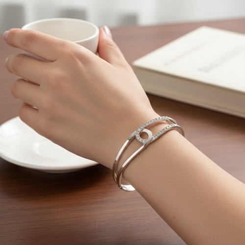 54 - A Sterling Silver 925 cuff bracelet with gemset accents. Weight - 13.04 grams. Boxed.