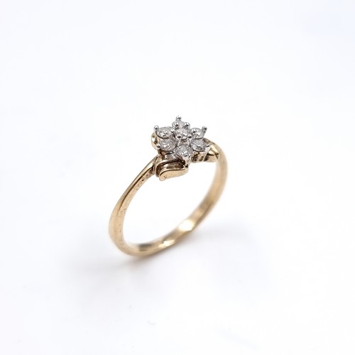 1 - Star Lot : A lovely nine carat gold Diamond Daisy cluster ring. Size - N. Weight 2.23 grams