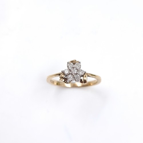 1 - Star Lot : A lovely nine carat gold Diamond Daisy cluster ring. Size - N. Weight 2.23 grams