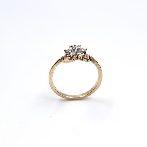 1 - Star Lot : A lovely nine carat gold Diamond Daisy cluster ring. Size - N. Weight 2.23 grams