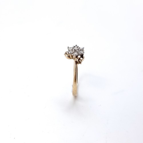 1 - Star Lot : A lovely nine carat gold Diamond Daisy cluster ring. Size - N. Weight 2.23 grams
