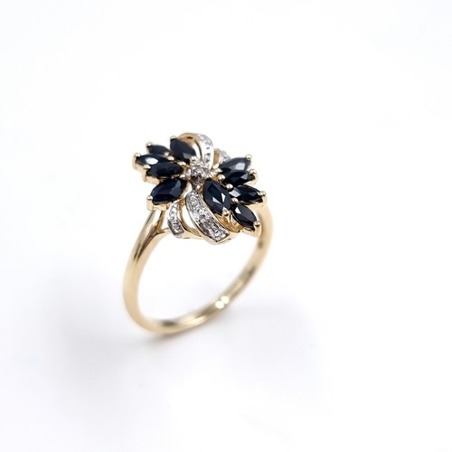 4 - Star Lot : A very impressive Diamond and Sapphire nine carat gold ring. Size - P, Weight - 3 grams.