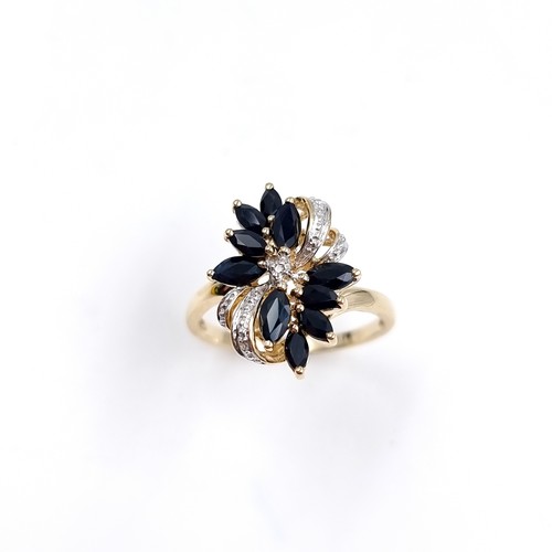 4 - Star Lot : A very impressive Diamond and Sapphire nine carat gold ring. Size - P, Weight - 3 grams.