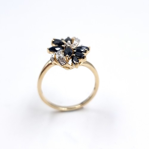4 - Star Lot : A very impressive Diamond and Sapphire nine carat gold ring. Size - P, Weight - 3 grams.