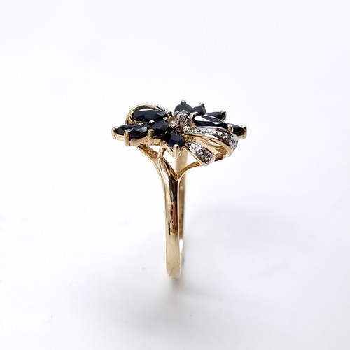 4 - Star Lot : A very impressive Diamond and Sapphire nine carat gold ring. Size - P, Weight - 3 grams.